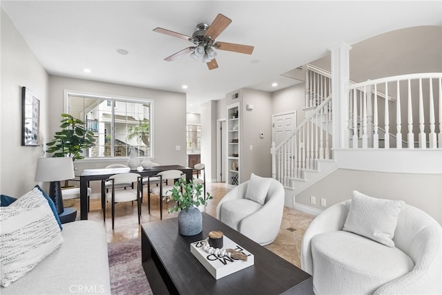 tiled living area with baseboards, stairway, visible vents, and recessed lighting