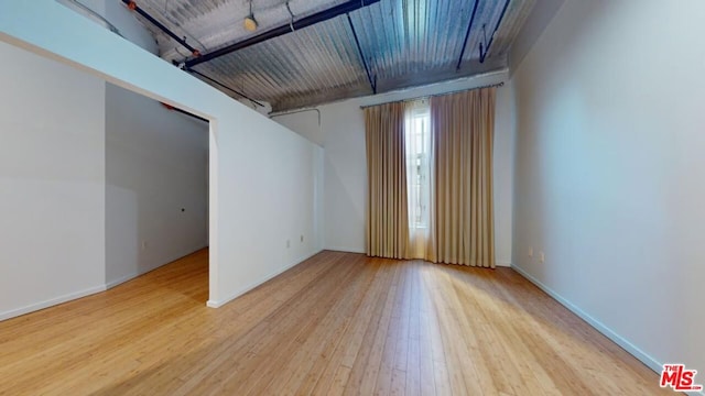 spare room featuring light hardwood / wood-style flooring