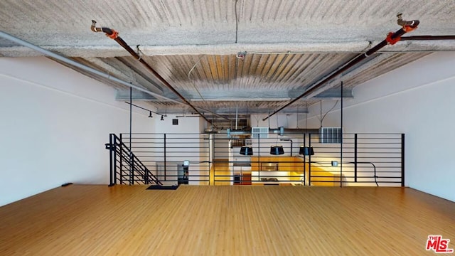 workout area featuring wood-type flooring