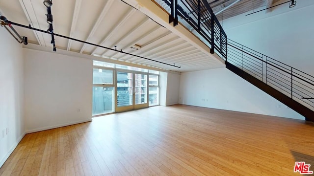 unfurnished living room featuring hardwood / wood-style flooring