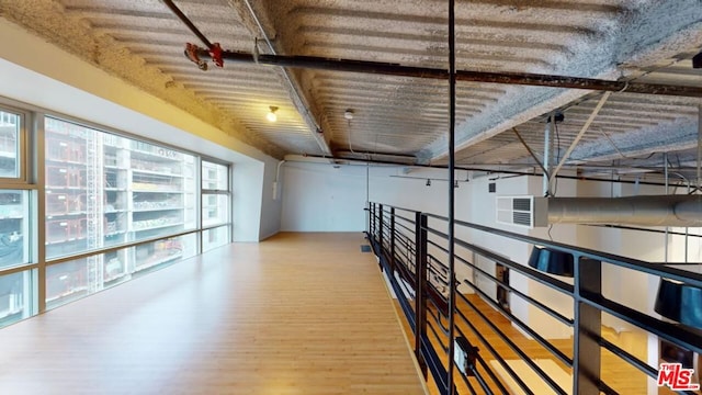 hallway with wood-type flooring