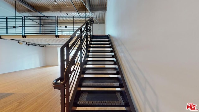 stairway with wood-type flooring