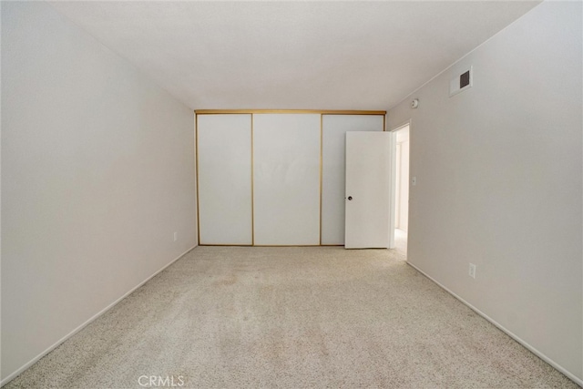 empty room with light colored carpet