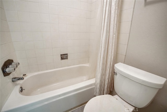 bathroom with toilet and shower / bath combo