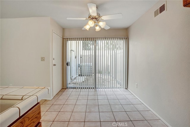 interior space featuring ceiling fan