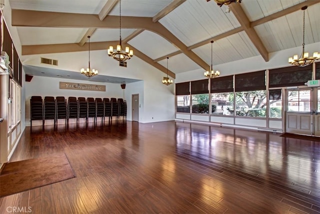 unfurnished living room with beamed ceiling, high vaulted ceiling, and dark hardwood / wood-style flooring