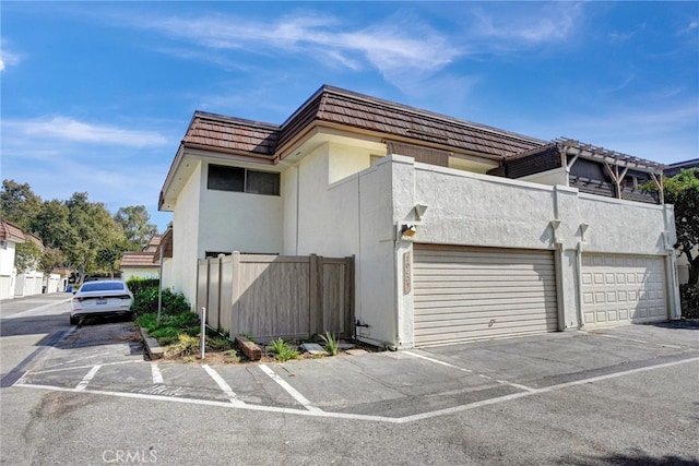 view of side of property with a garage