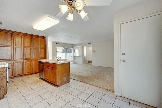 kitchen with dishwasher, light carpet, a center island with sink, sink, and ceiling fan