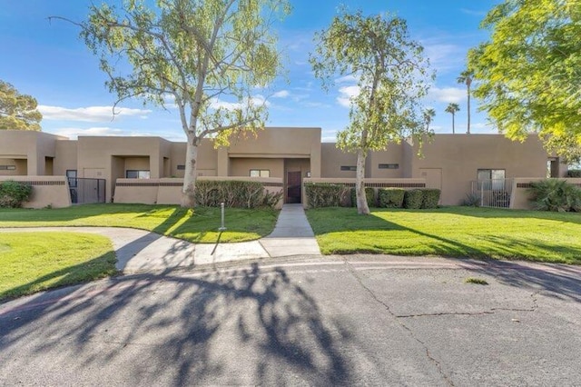 southwest-style home with a front yard