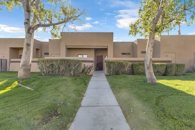 view of front of property with a front lawn