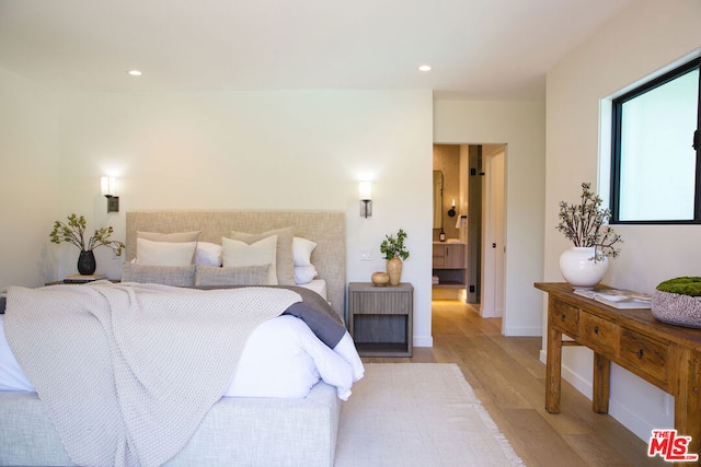 bedroom with light hardwood / wood-style flooring