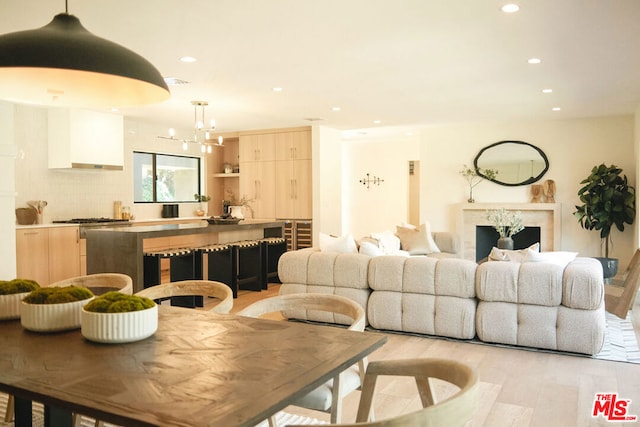 living room featuring light hardwood / wood-style floors and a fireplace