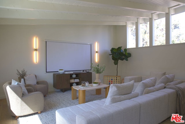 living room featuring lofted ceiling with beams, hardwood / wood-style flooring, and wooden ceiling