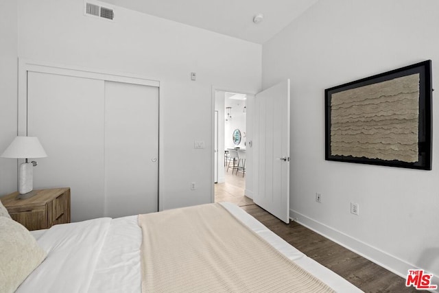 bedroom featuring a closet and wood-type flooring