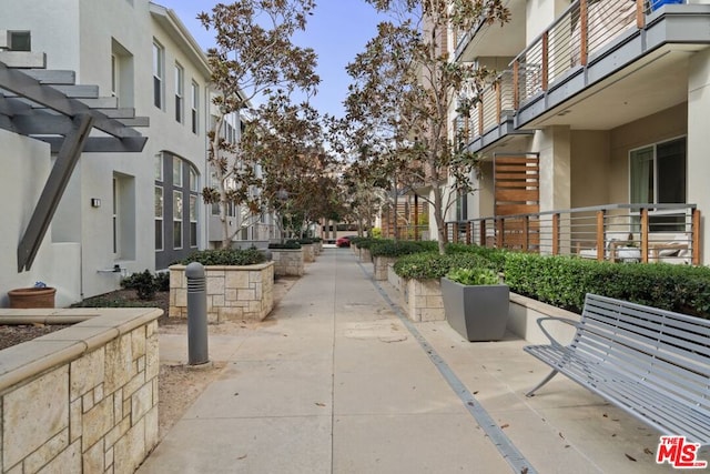 view of home's community featuring a pergola