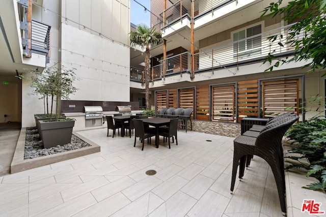 view of patio featuring area for grilling and exterior kitchen