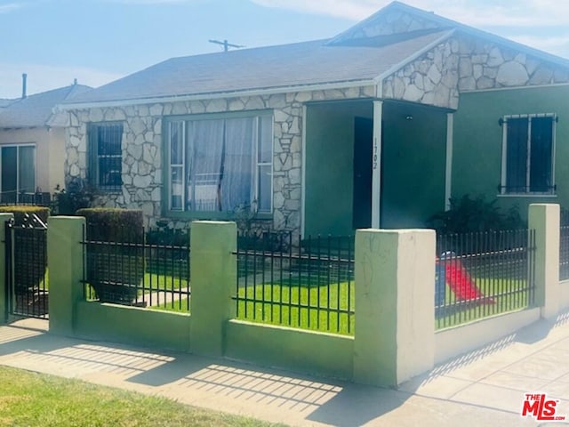 view of gate featuring a yard