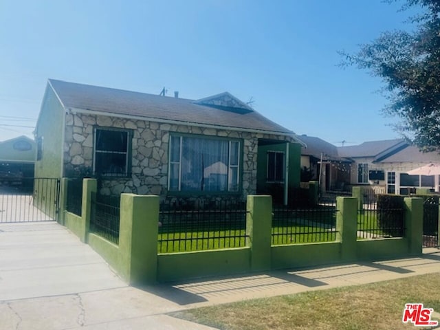 view of side of property with a yard