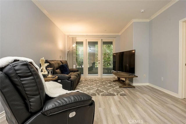 living room featuring ornamental molding and light wood-type flooring