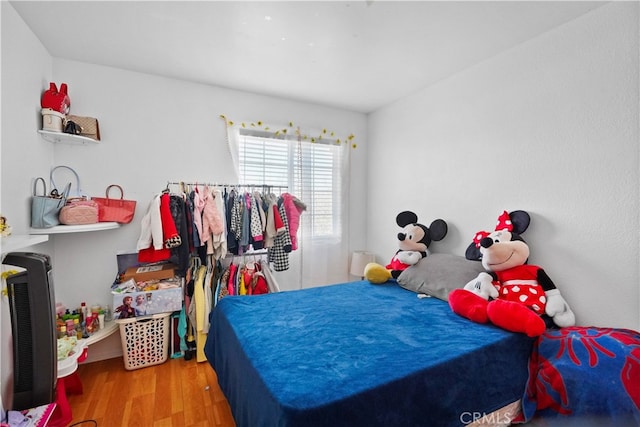 bedroom featuring wood-type flooring