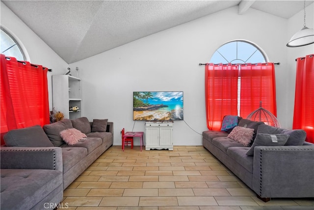 living room with a textured ceiling, light hardwood / wood-style flooring, beam ceiling, and high vaulted ceiling