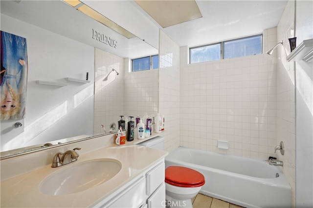 full bathroom with tile patterned flooring, vanity, toilet, and tiled shower / bath