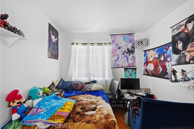 bedroom featuring hardwood / wood-style flooring