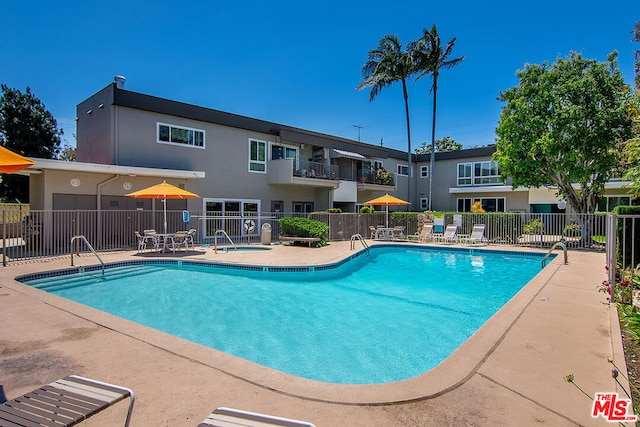 view of swimming pool featuring a patio