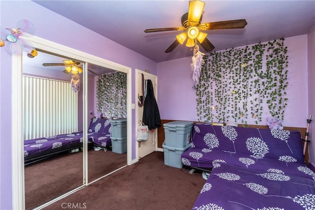 carpeted bedroom featuring a closet and ceiling fan