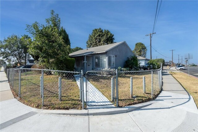 bungalow-style house featuring a front yard