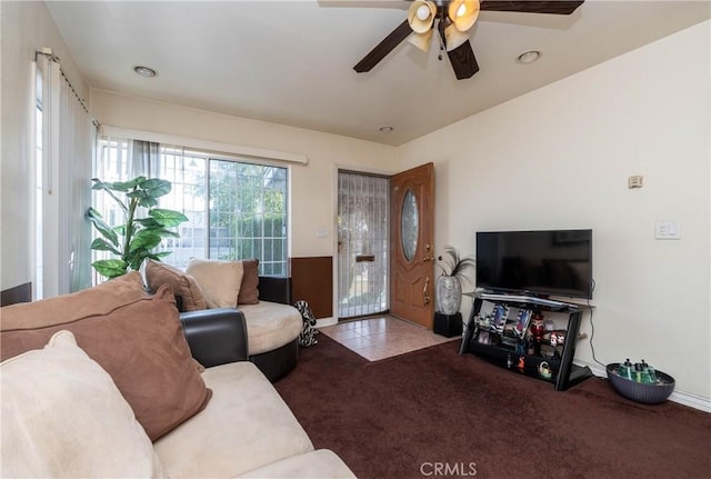 living room with ceiling fan and light colored carpet