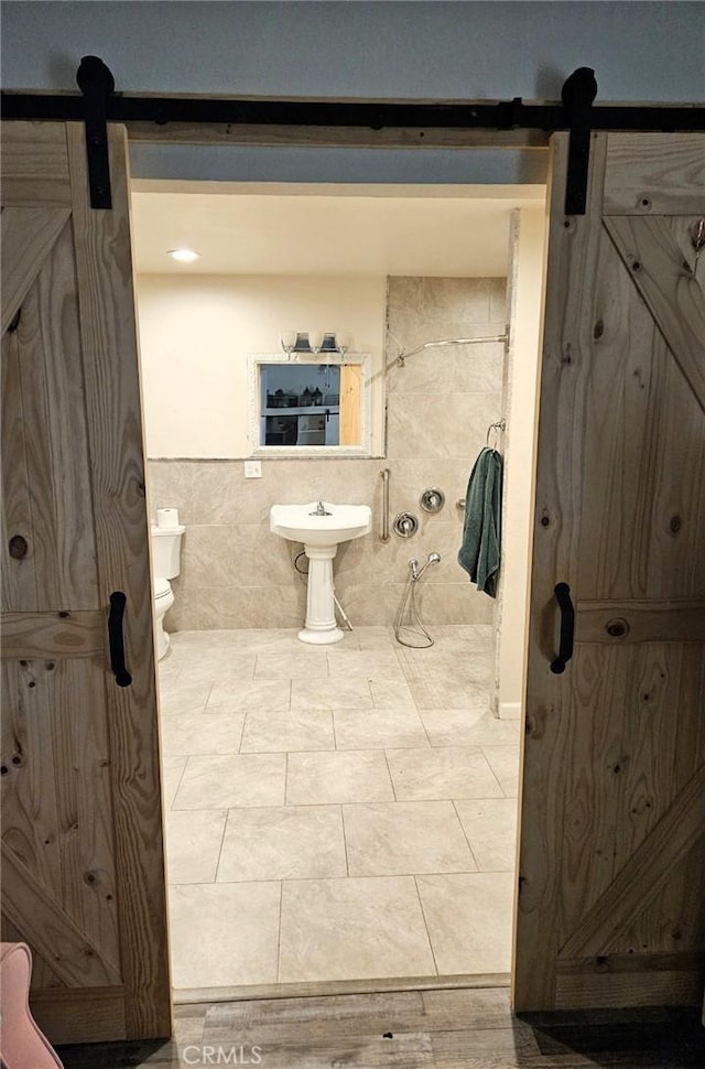 bathroom with tile patterned floors and toilet