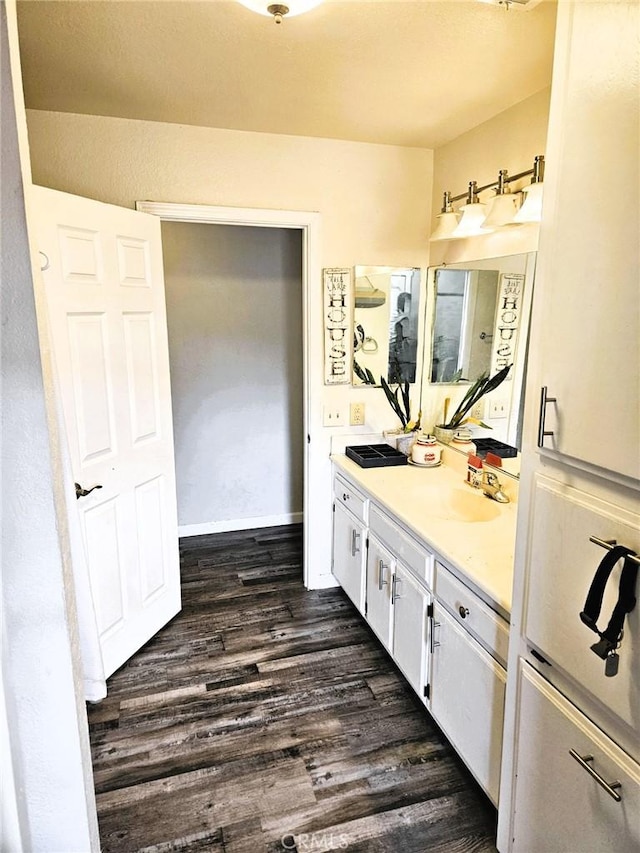 bathroom featuring vanity and hardwood / wood-style floors