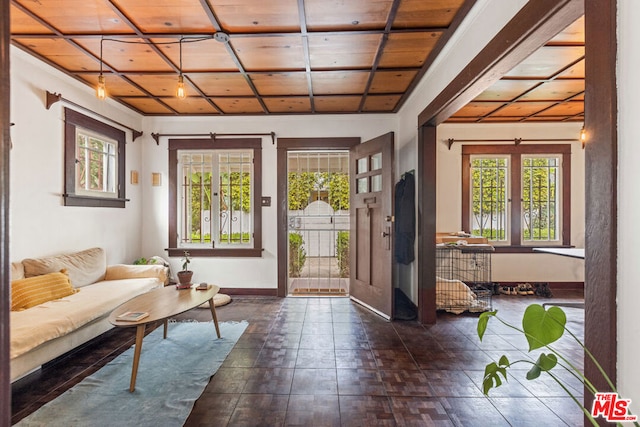 entryway featuring french doors, a wealth of natural light, and wood ceiling