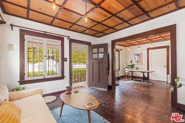 interior space featuring wooden ceiling, radiator, and french doors