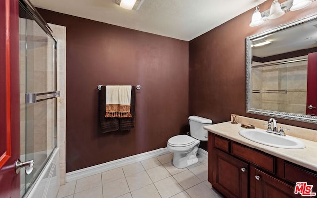 full bathroom featuring enclosed tub / shower combo, tile patterned flooring, vanity, and toilet