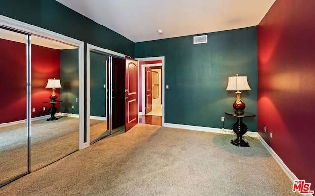 unfurnished bedroom featuring carpet