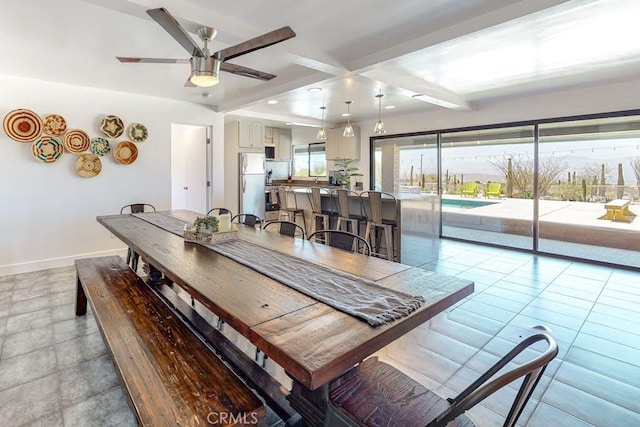 dining space featuring a wealth of natural light, ceiling fan, beamed ceiling, and light tile patterned flooring