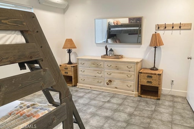 bedroom with a wall mounted air conditioner