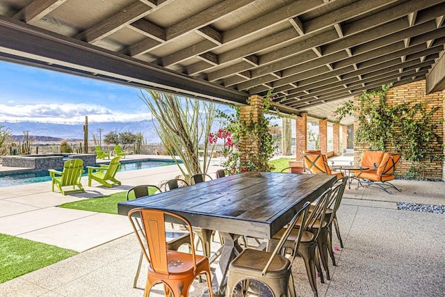 view of patio / terrace featuring a mountain view