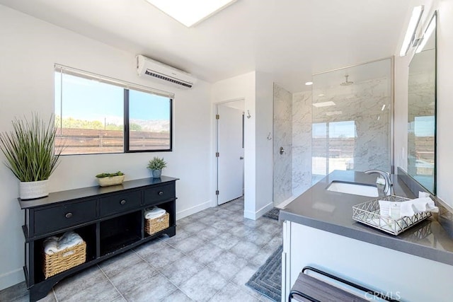 bathroom with vanity, an AC wall unit, and tiled shower