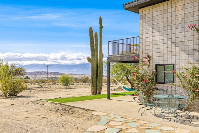 view of patio / terrace featuring a mountain view