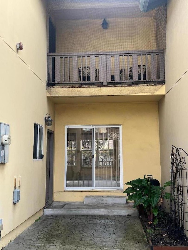 doorway to property with a balcony