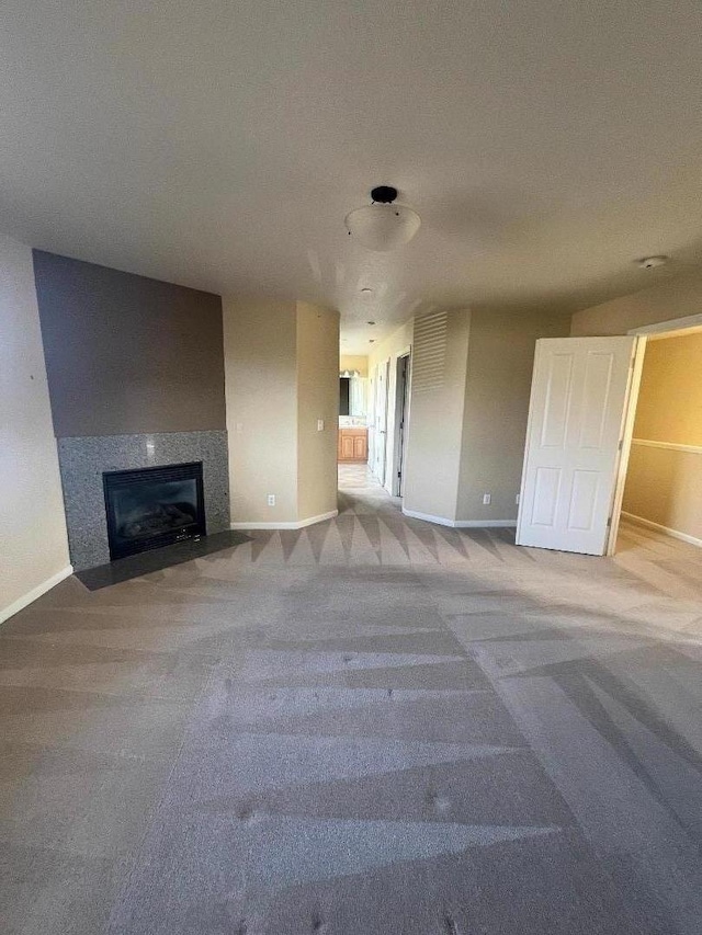 unfurnished living room with carpet