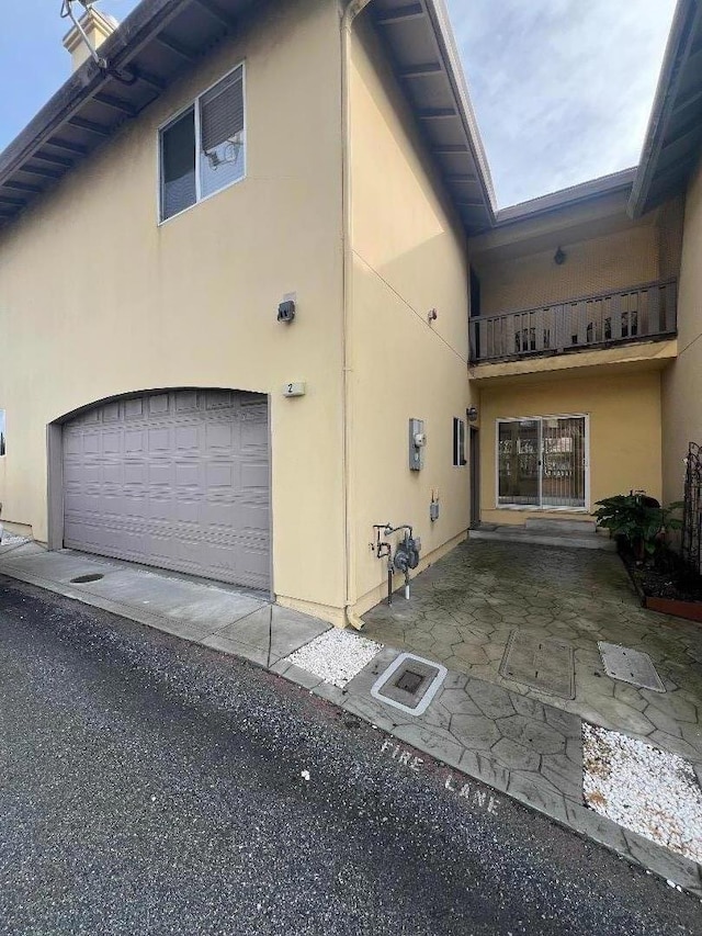 view of property exterior featuring a garage