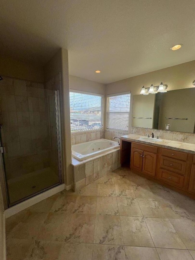 bathroom with vanity and plus walk in shower