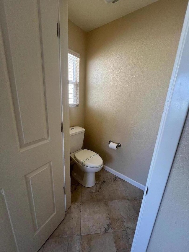 bathroom featuring toilet