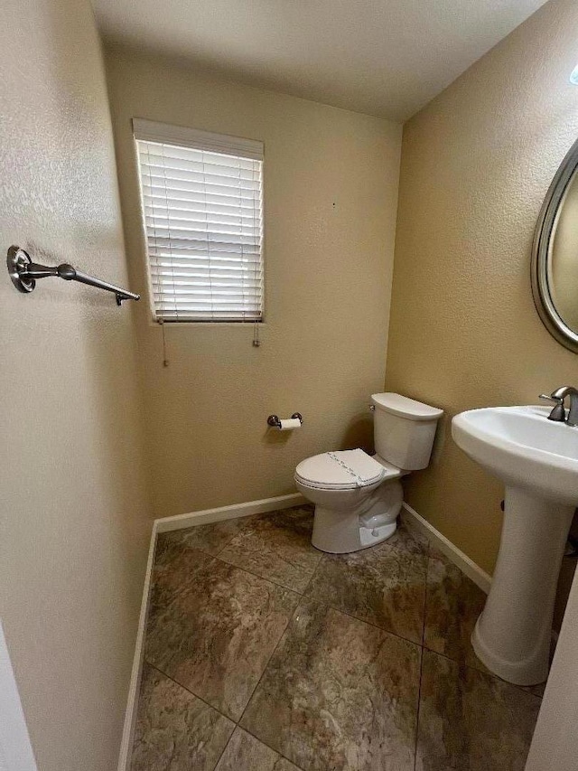 bathroom with toilet and sink