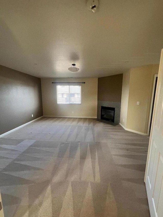 unfurnished living room with carpet floors