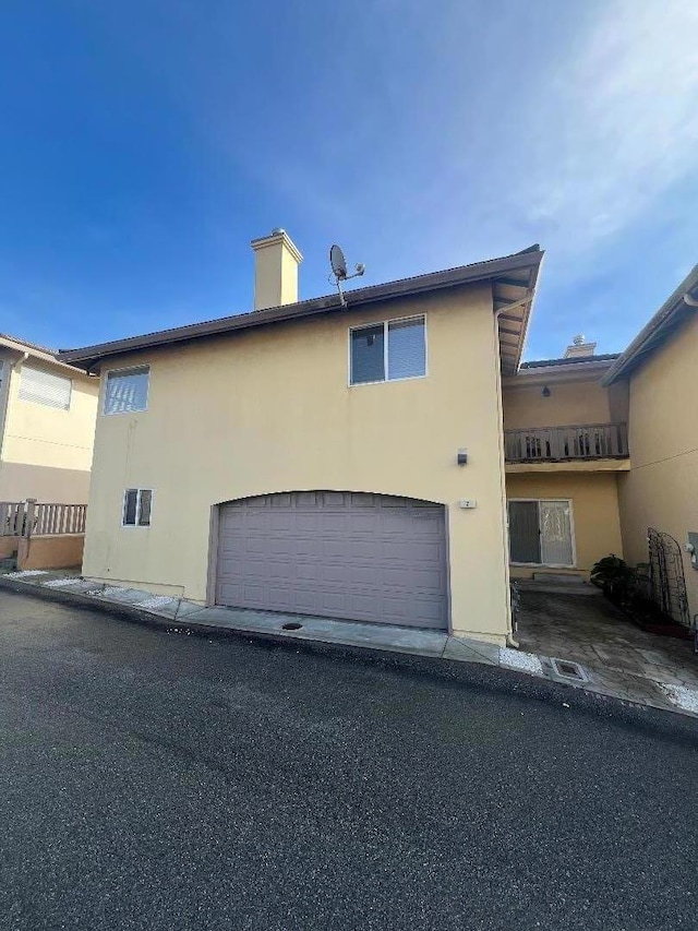 view of property exterior with a garage